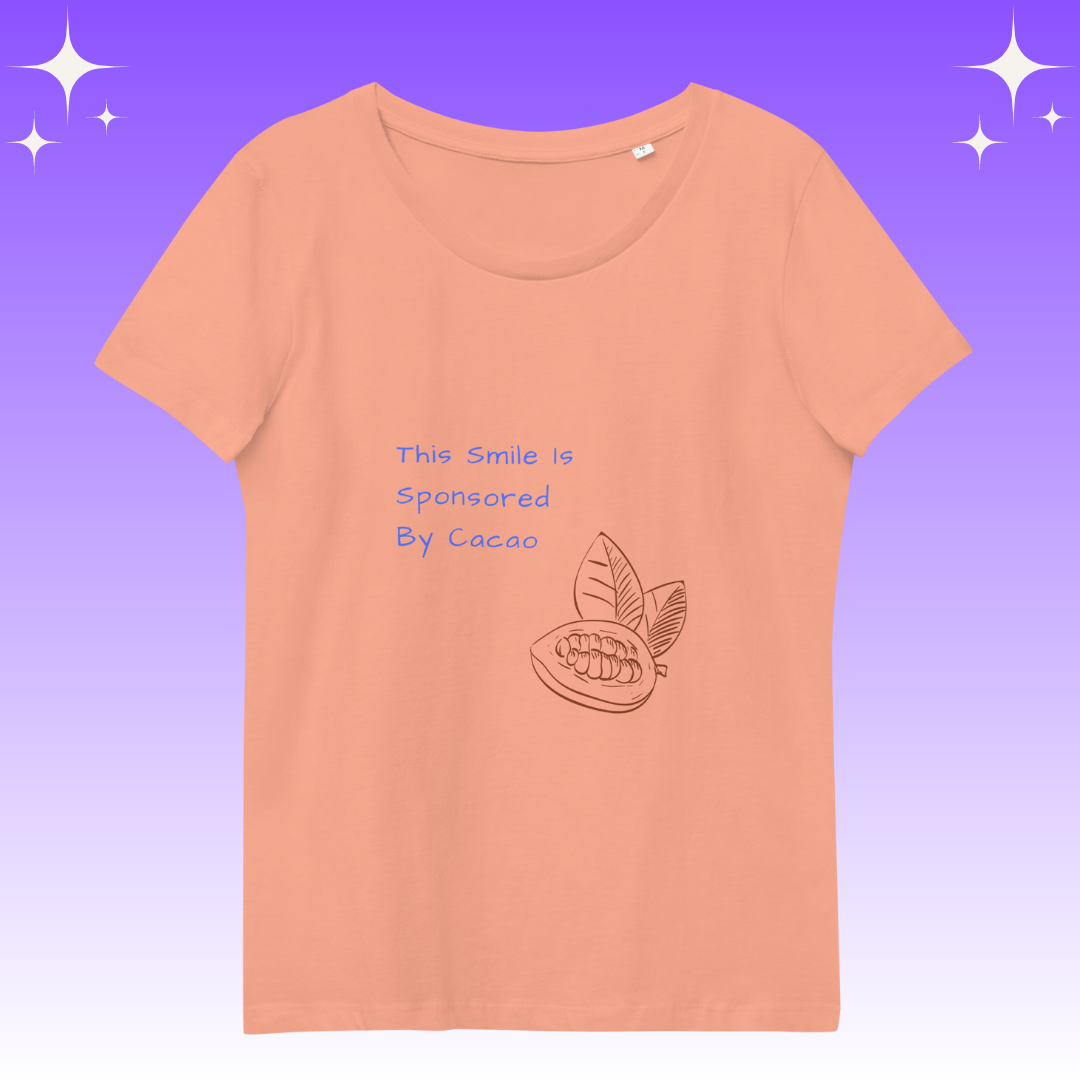 "This Smie is Sponsored by Cacao" Dopamine Dressing Women's fit t-shirt design peach flat lay
